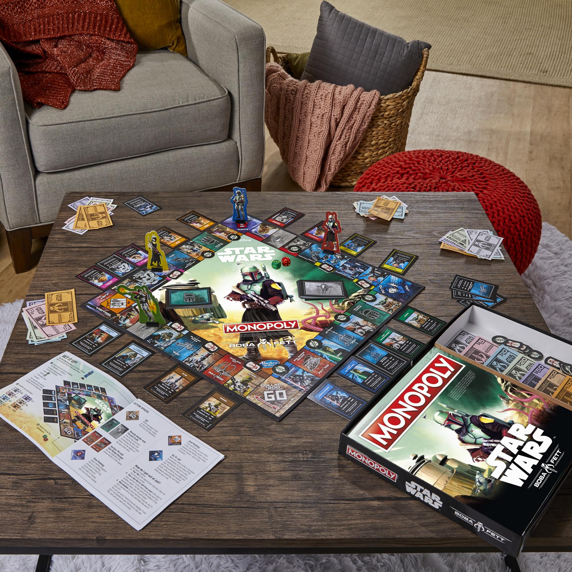 Hasbro Gaming Monopoly Star Wars Boba Fett Edition dice and card components for play.