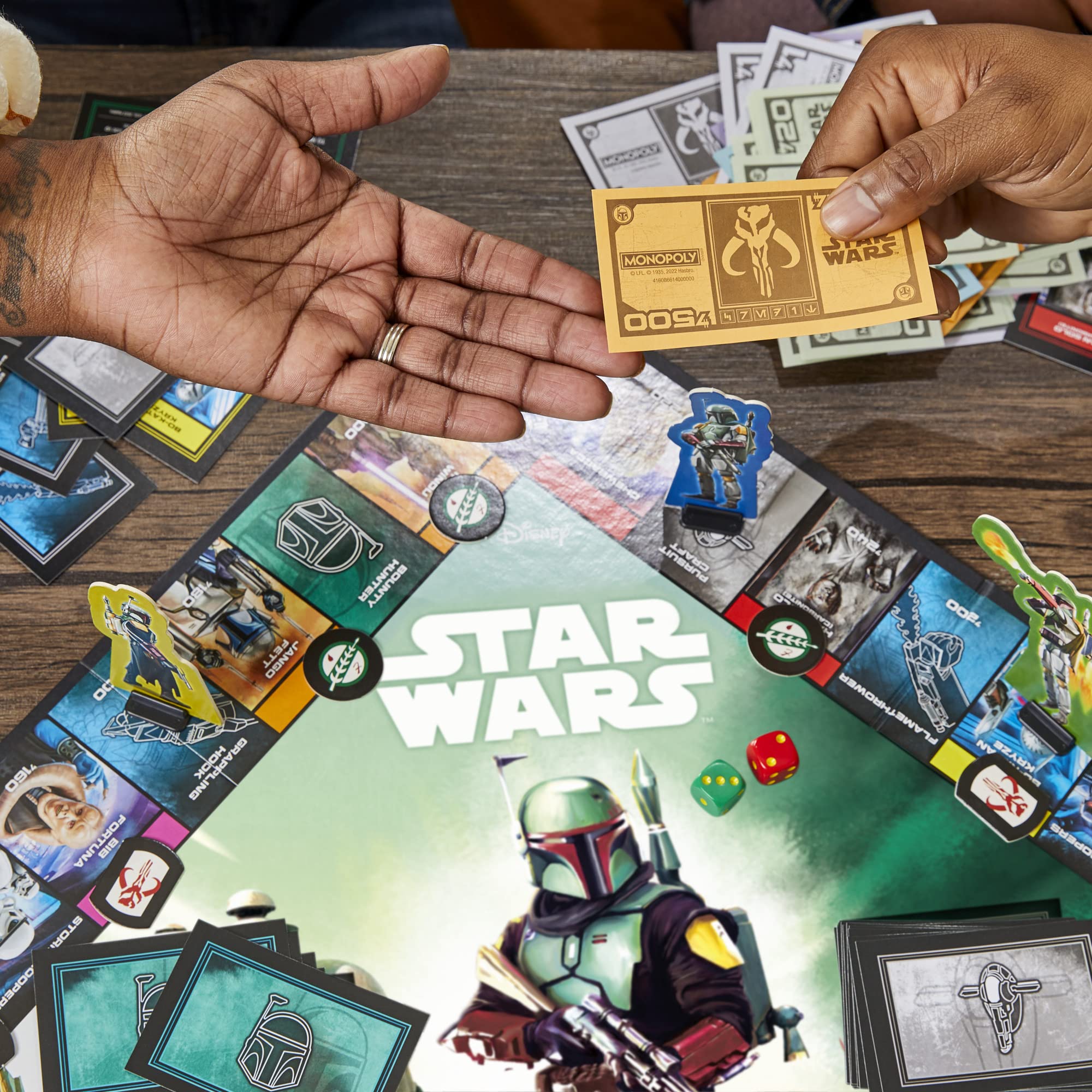 Hasbro Gaming Monopoly Star Wars Boba Fett Edition Mandalorian icons enhance fan experience.