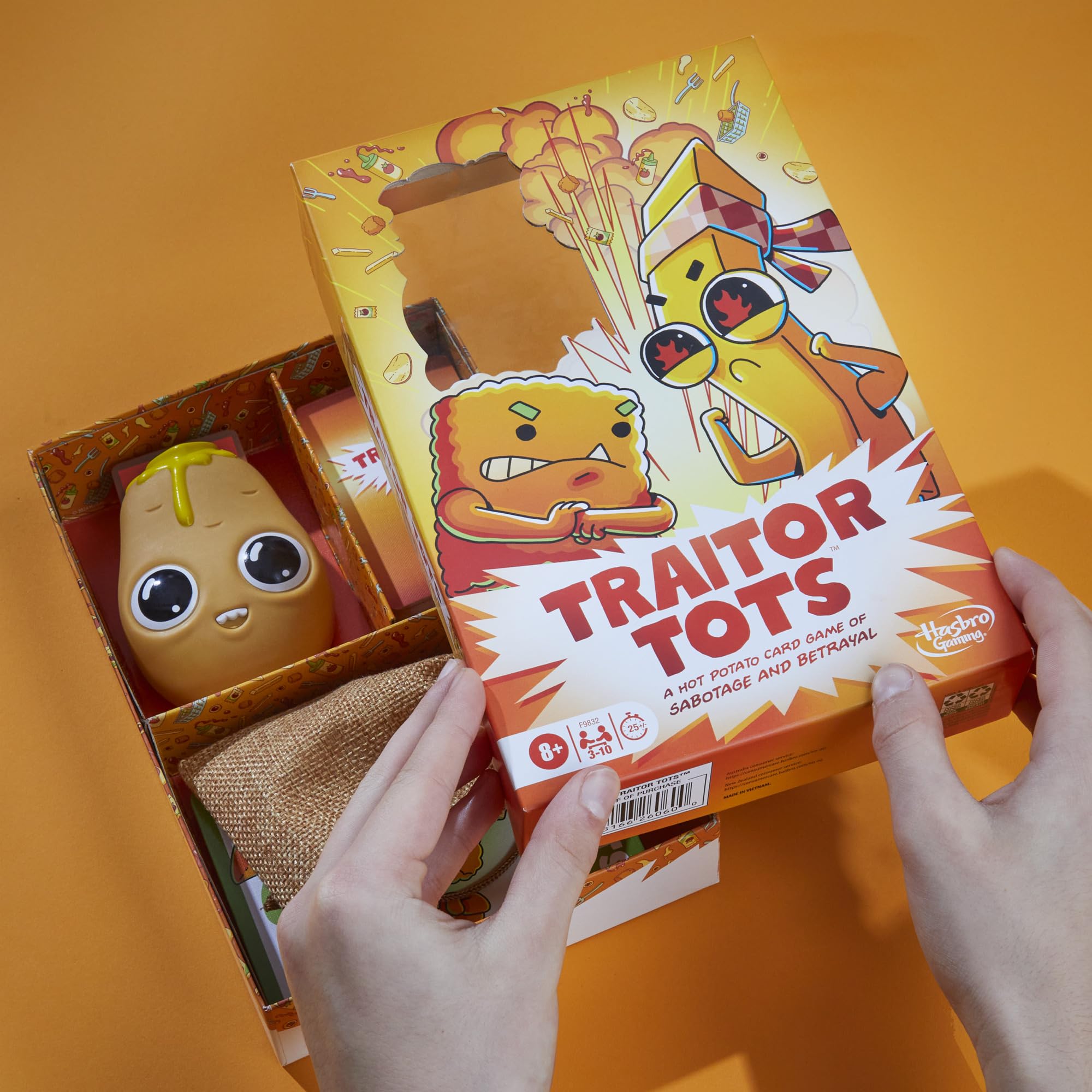 Hasbro Gaming Traitor Tots oven mitts motif adds tactile charm.