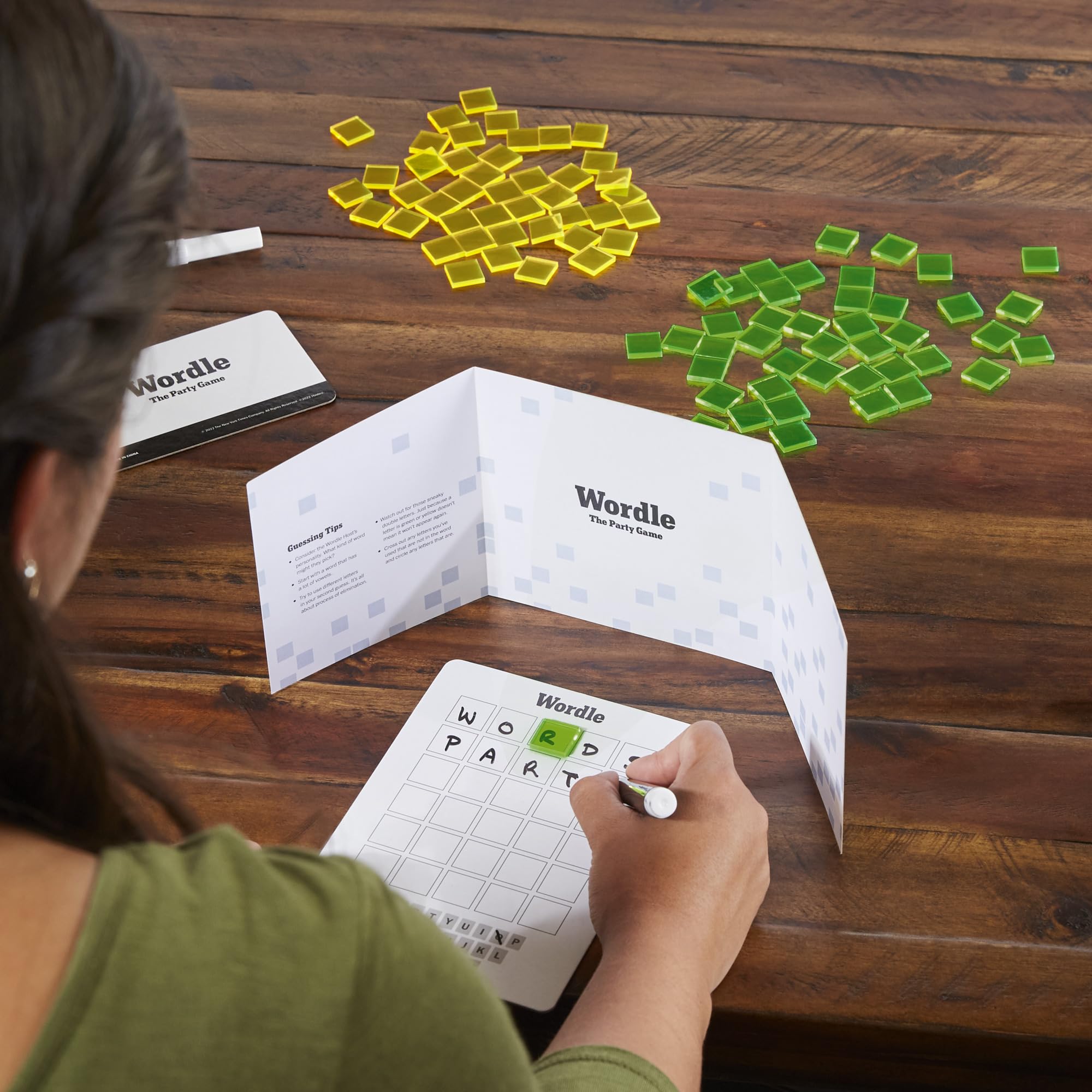 Hasbro Wordle: The Party Game 5-letter Secret Word written by the host into play.