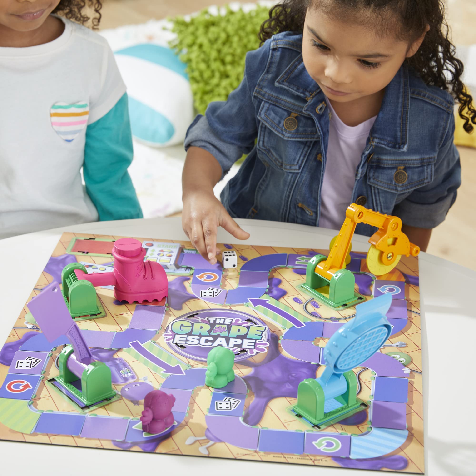 Hasbro Grape Escape launcher visible on the board