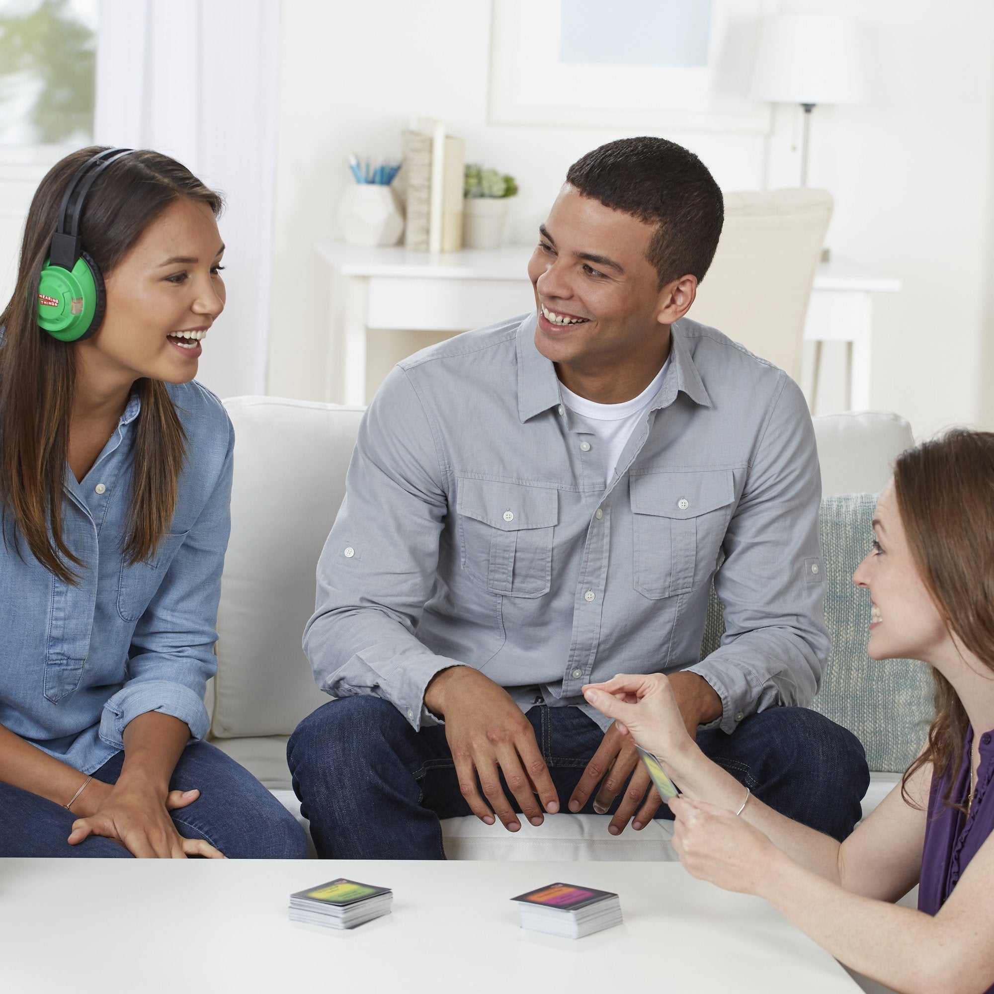 Hasbro Hearing Things game cards with 600 phrases for lively group play.