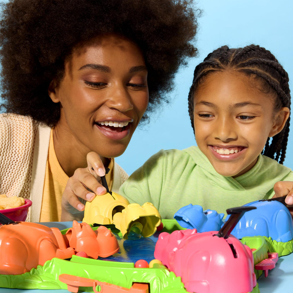 Hasbro Hungry Hungry Hippos family game night scene shows a quick setup.
