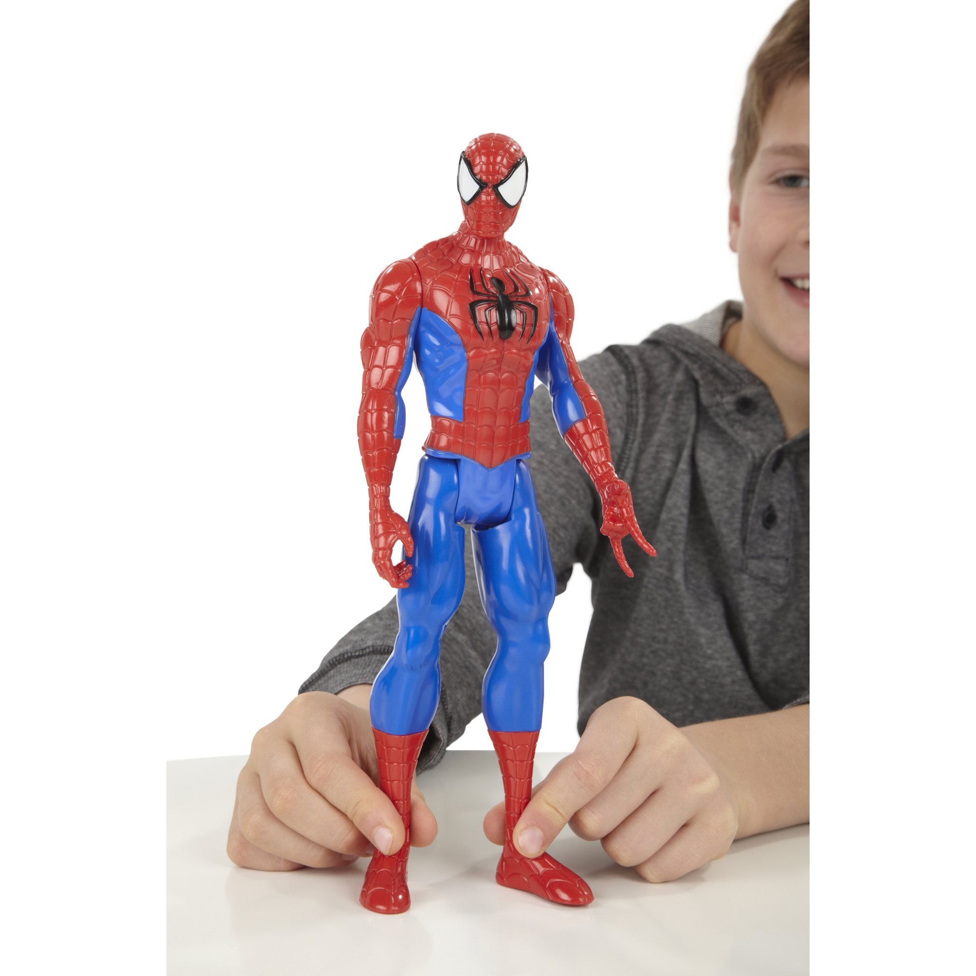 Hasbro Marvel Ultimate Spider-Man figure against colorful play backdrop.