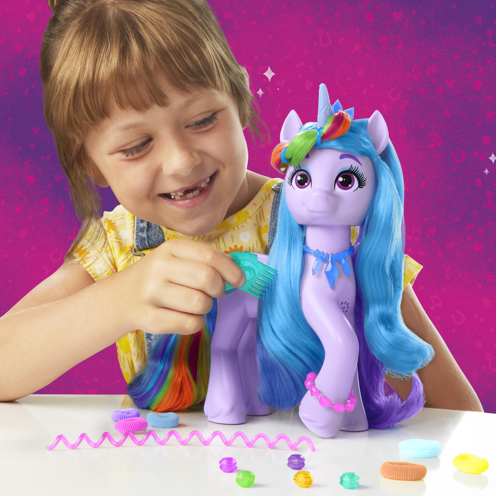 Hasbro My Little Pony Izzy Moonbow rainbow hair clip and purple ribbon