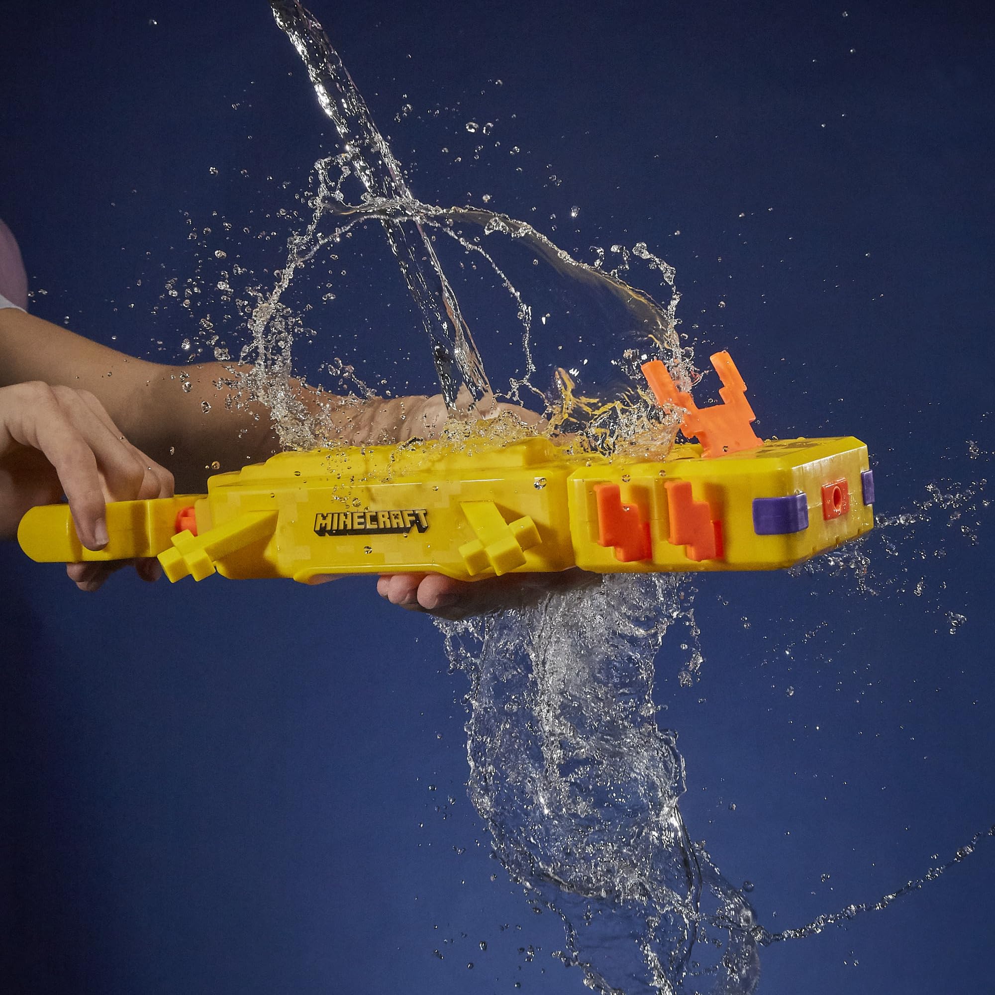Hasbro Nerf Super Soaker Minecraft Axolotl Blaster being filled with move-fill handle