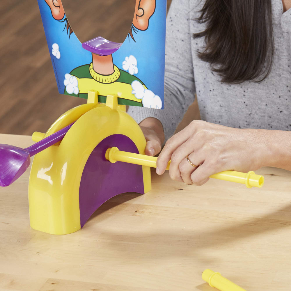 Hasbro Pie Face Game assembly and setup process shown for quick play.