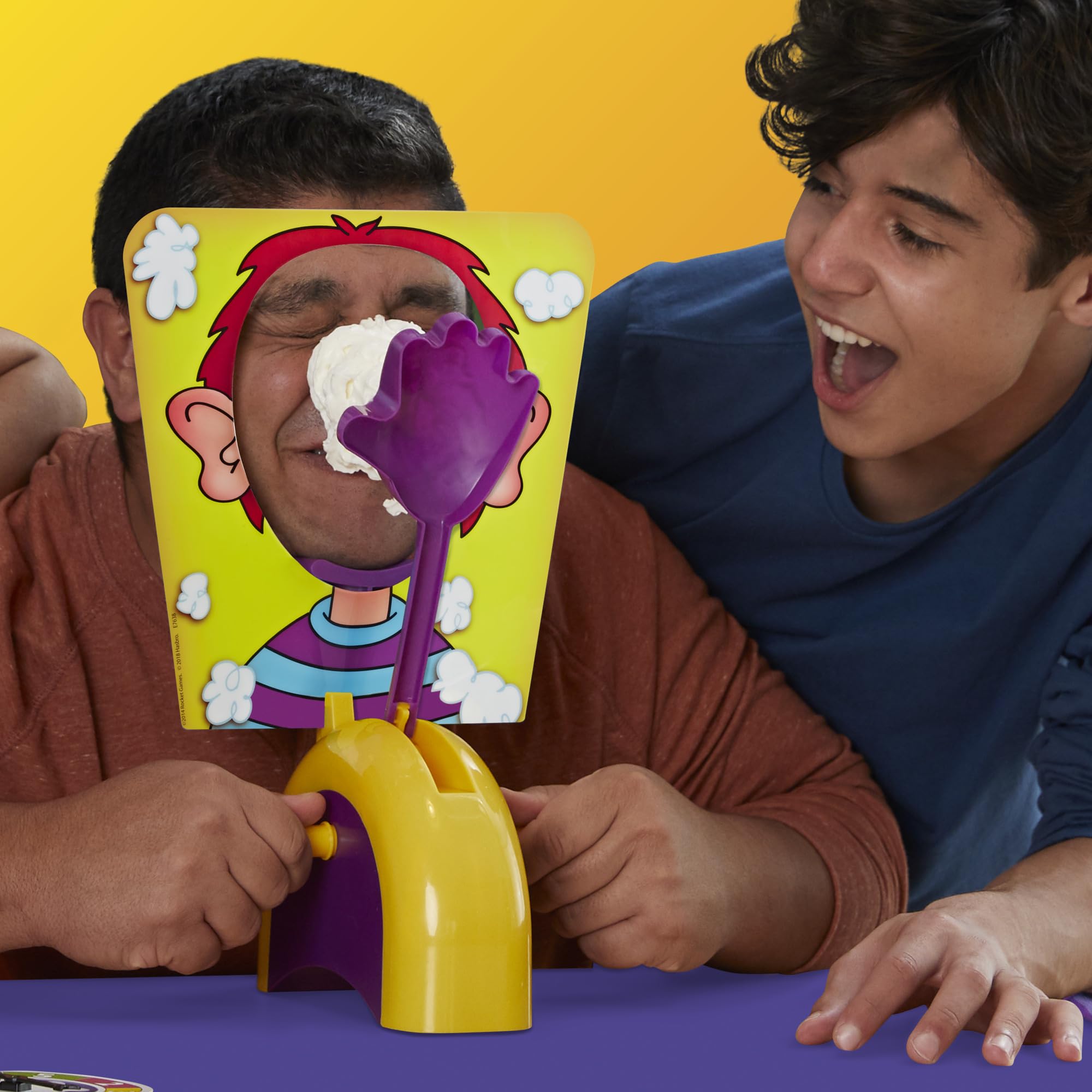 Hasbro Pie Face players laughing during a turn
