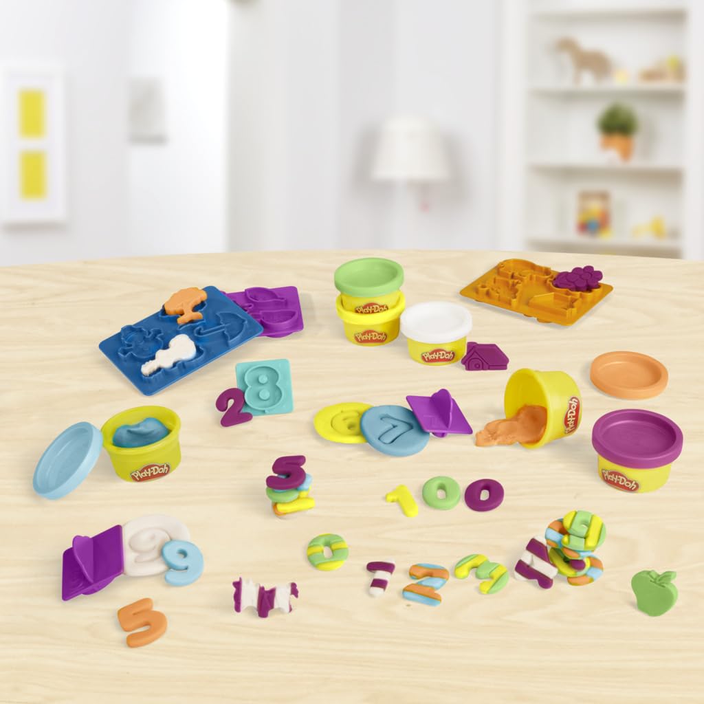 Counting activity with number stampers and molds to guide practice.