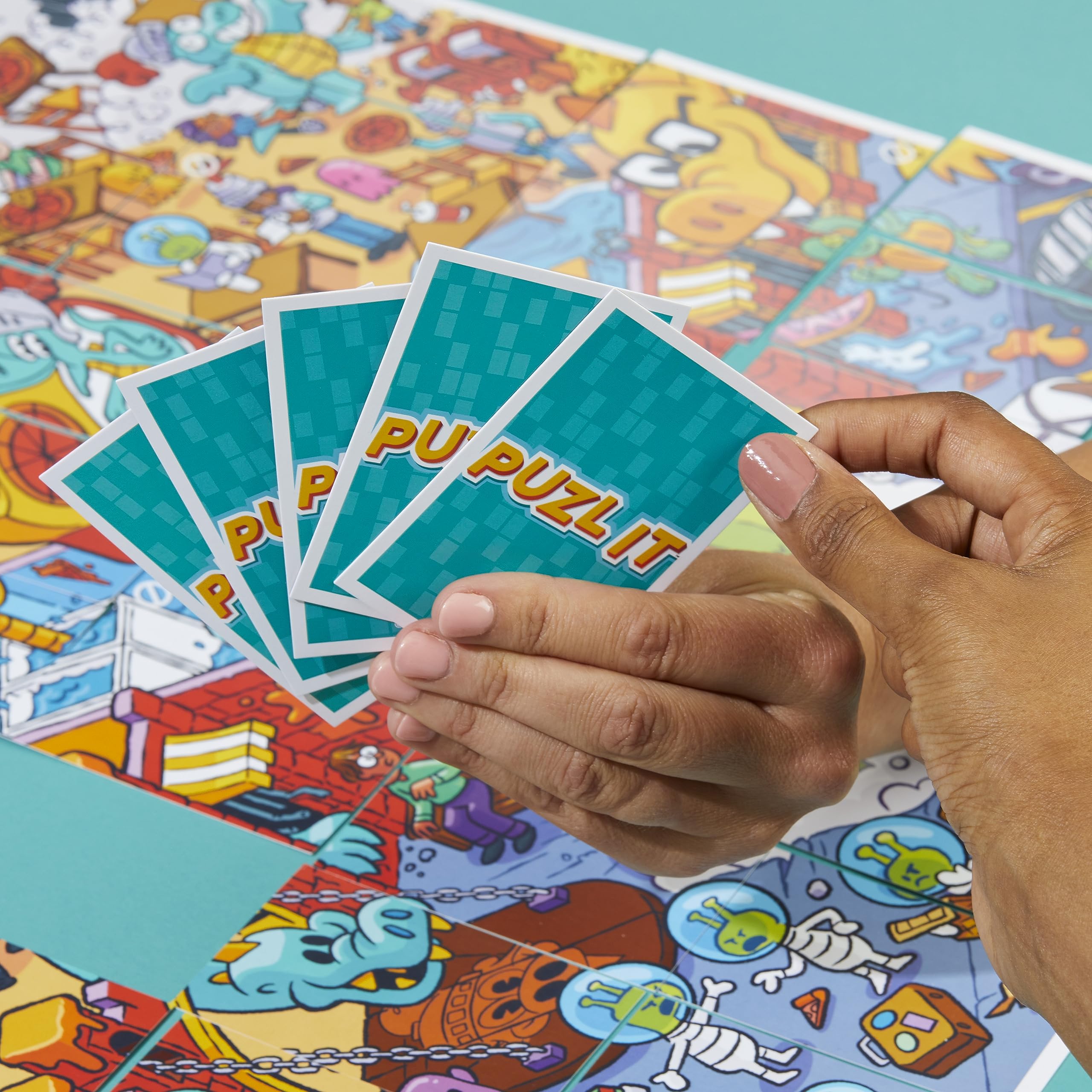 Hasbro Puzl It game: last-with-cards-win scene emphasizes endgame thrill and victory potential.