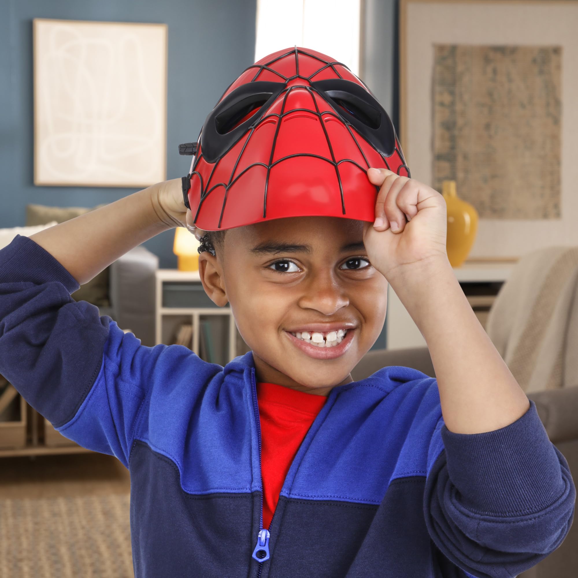 Hasbro Spider-Man Glow FX Mask side lever activates light-up eye lenses during action play.
