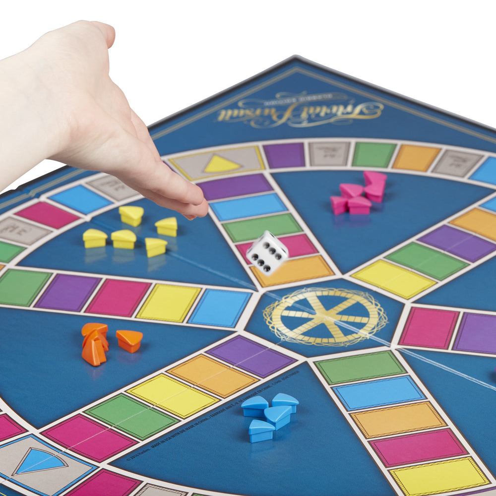 Hasbro Trivial Pursuit wedges showing color-coded category edges for scoring.