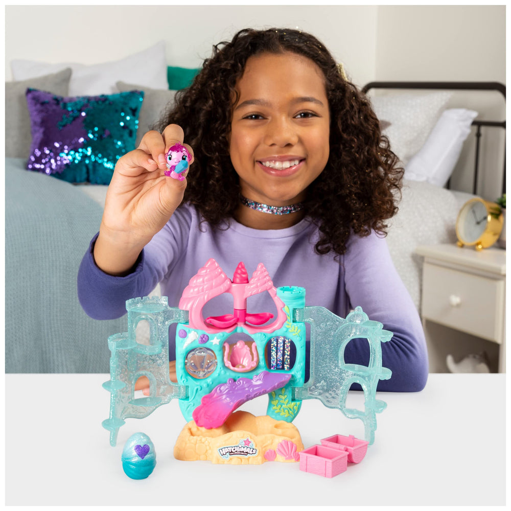 Hatchimals Coral Castle seashell spinner invites rotation for dynamic pretend play.