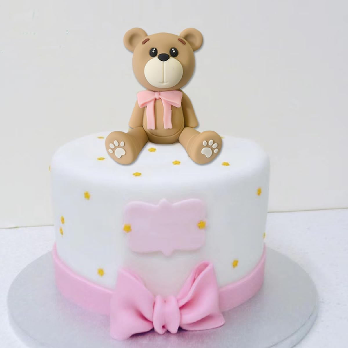 HAVAGDTM pink bear topper is a ready-to-use party accessory for cakes.
