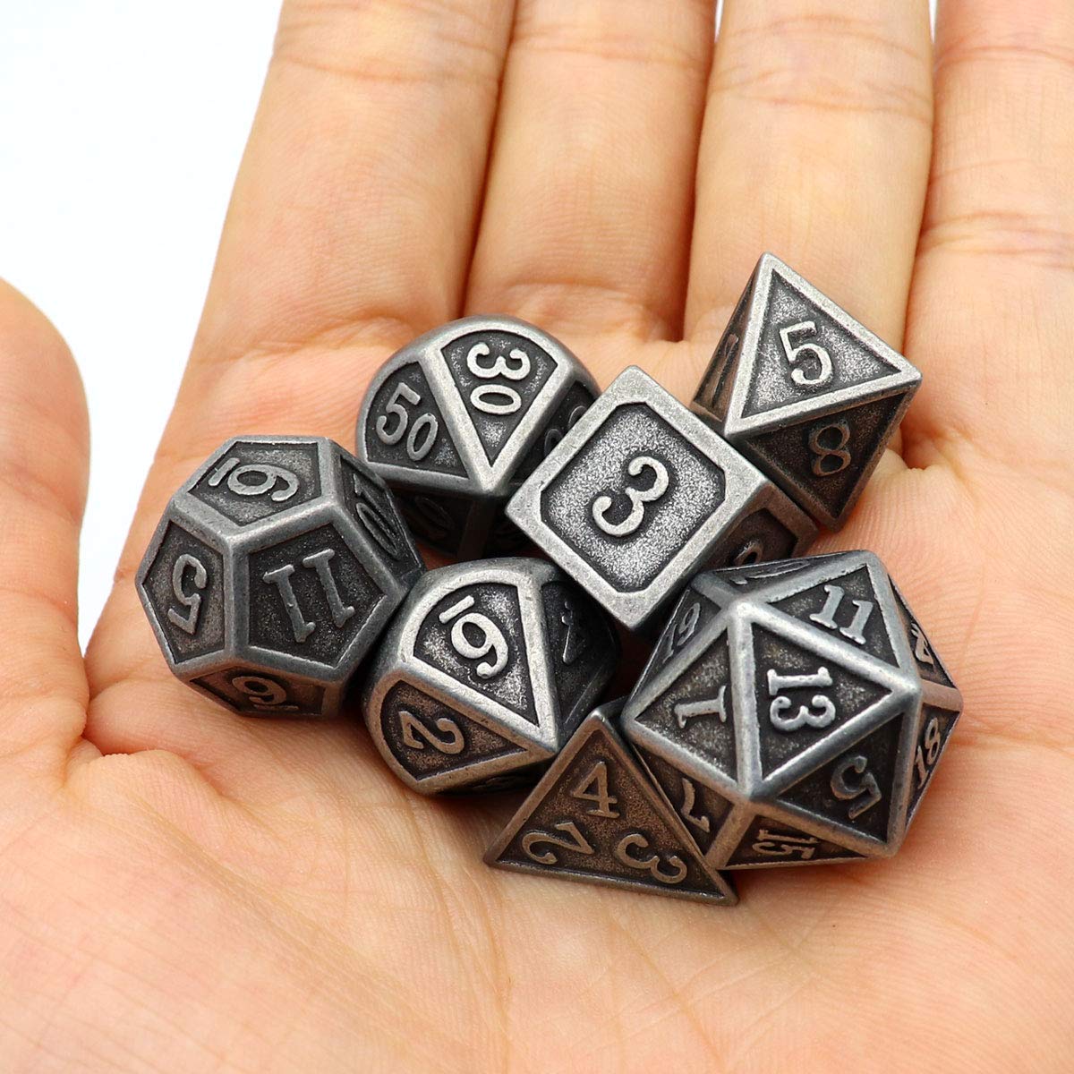 Haxtec burnished blacksmith style dice evoke classic fantasy aesthetics.