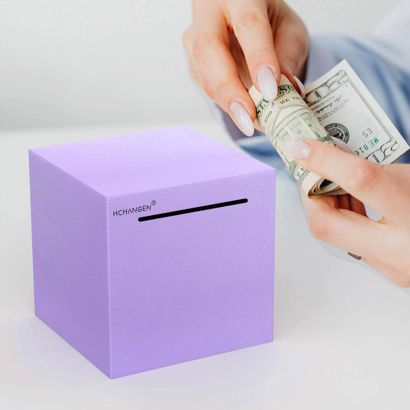 HCHANGEN piggy bank shown for adults and kids, an approachable way to learn money management.