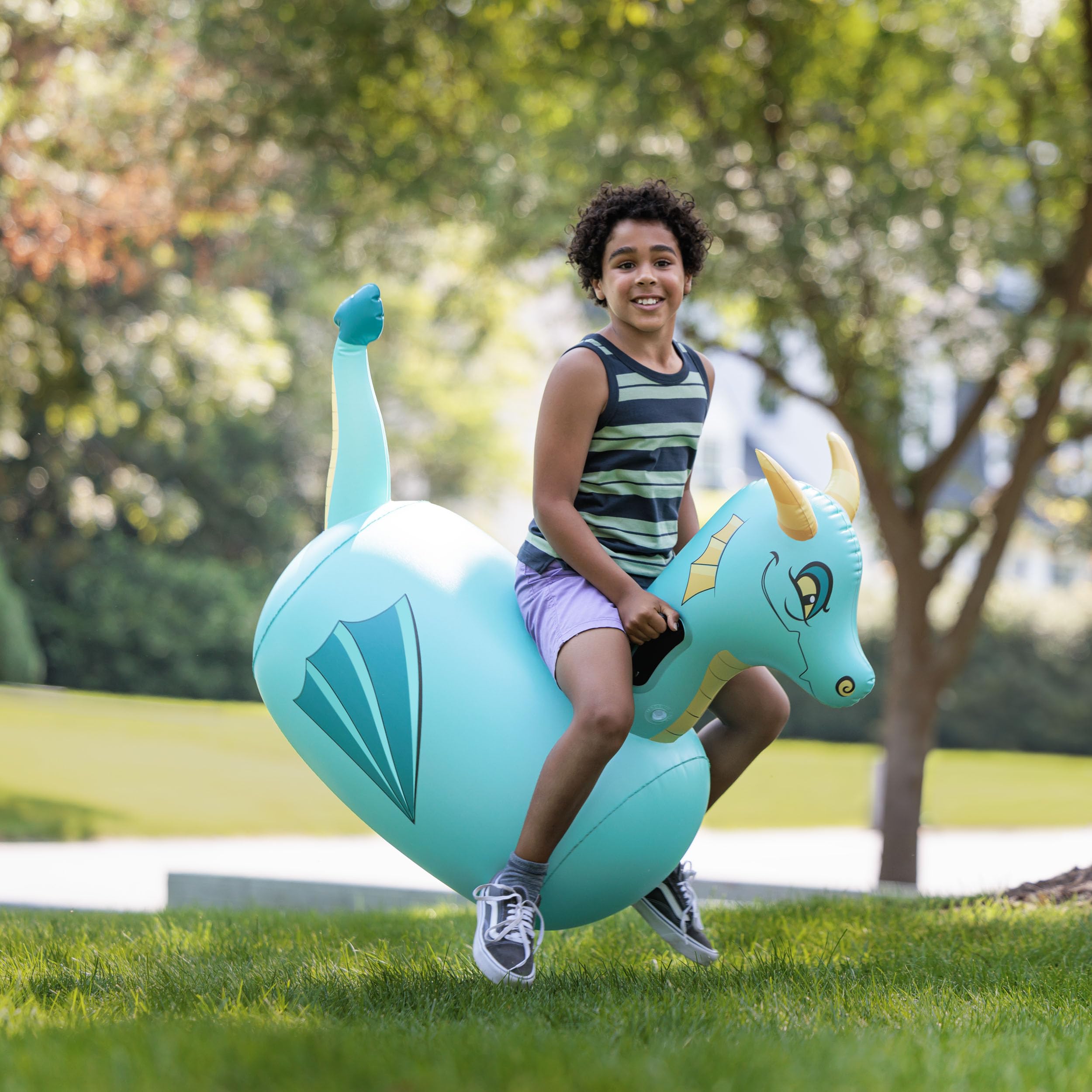 Child riding the blue dragon Hop N Go for imaginative adventures