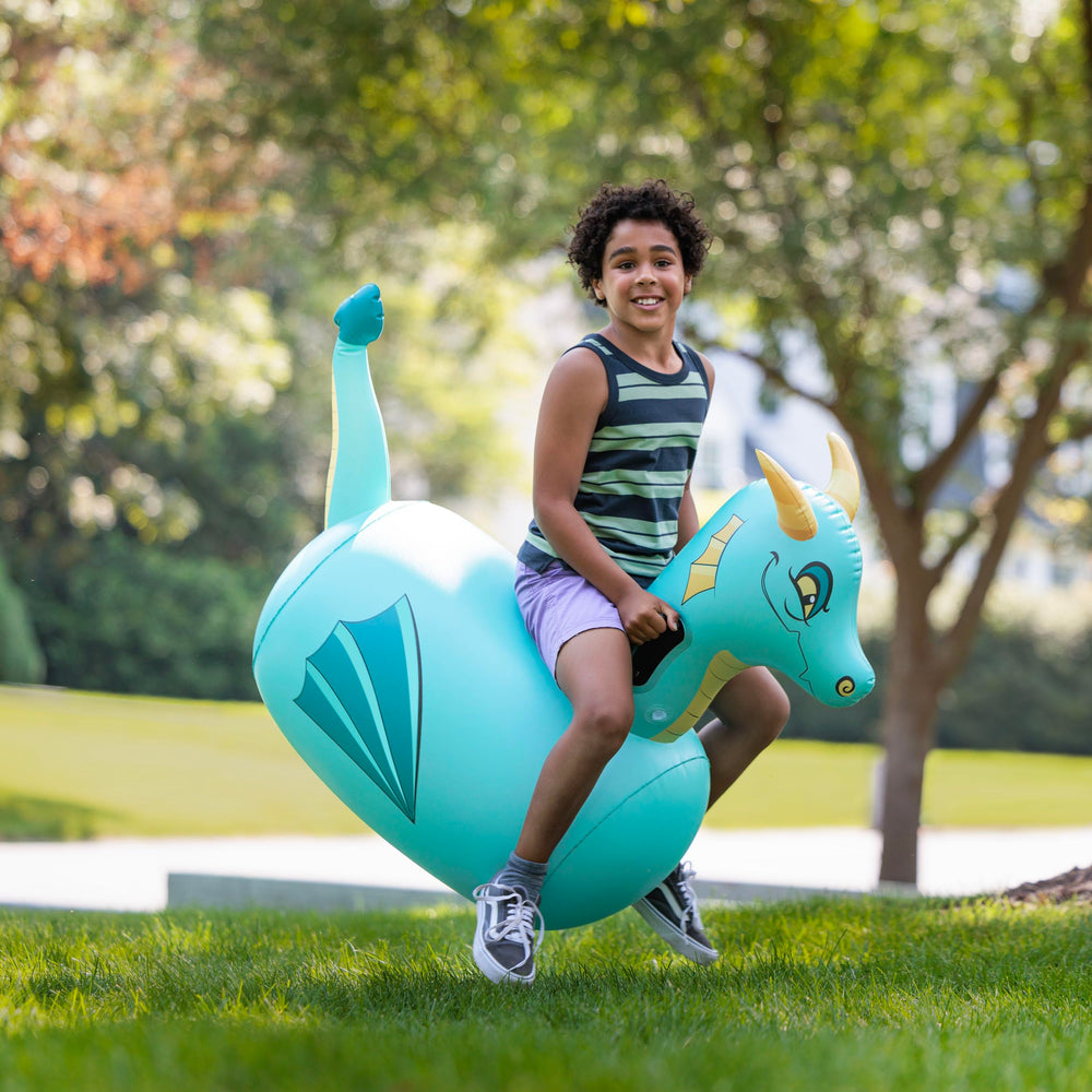 Child riding the blue dragon Hop N Go for imaginative adventures