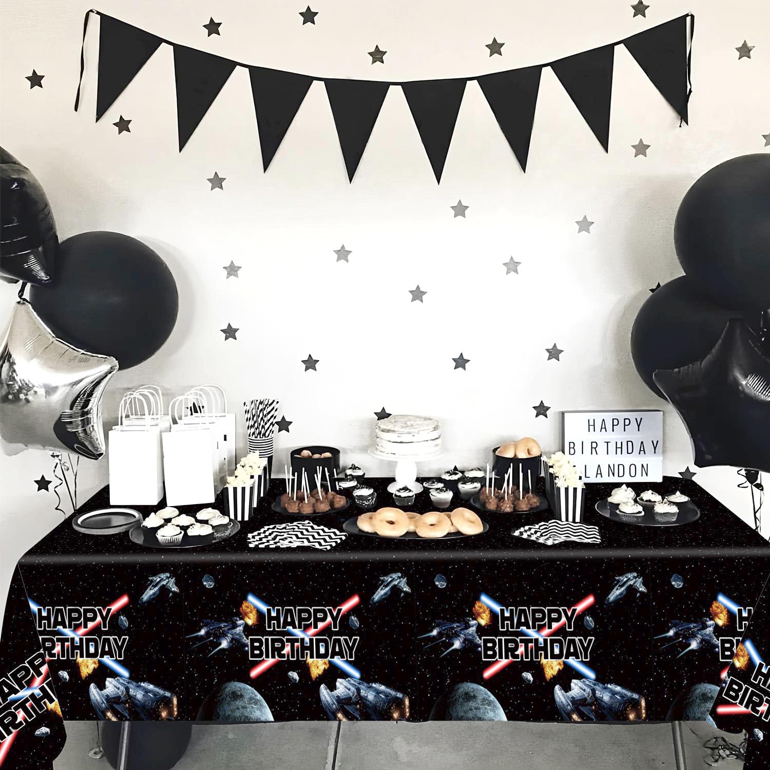 Heboland space tablecloth creates a family-friendly galaxy vibe.