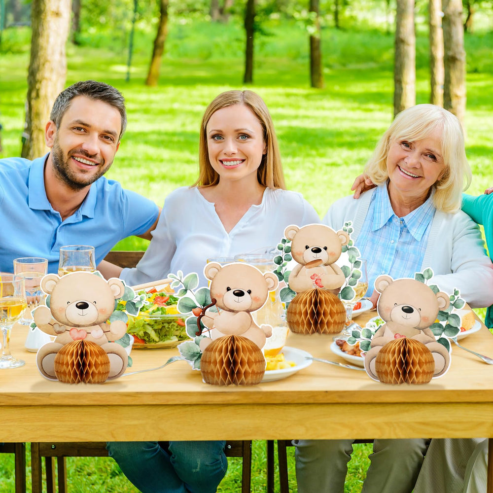 Hiboom bear honeycomb centerpiece on a gift table for celebration
