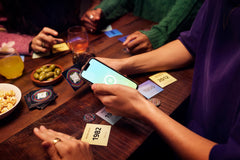 Hitster with Spotify integration on screen, smooth streaming enhances gameplay.