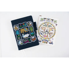 Hobonichi Iyo Okumi pencil board with Happy Tea Time embroidery on linen, adding artisanal flair to planning