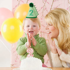 HODIHIWI dinosaur hat worn by child at indoor party
