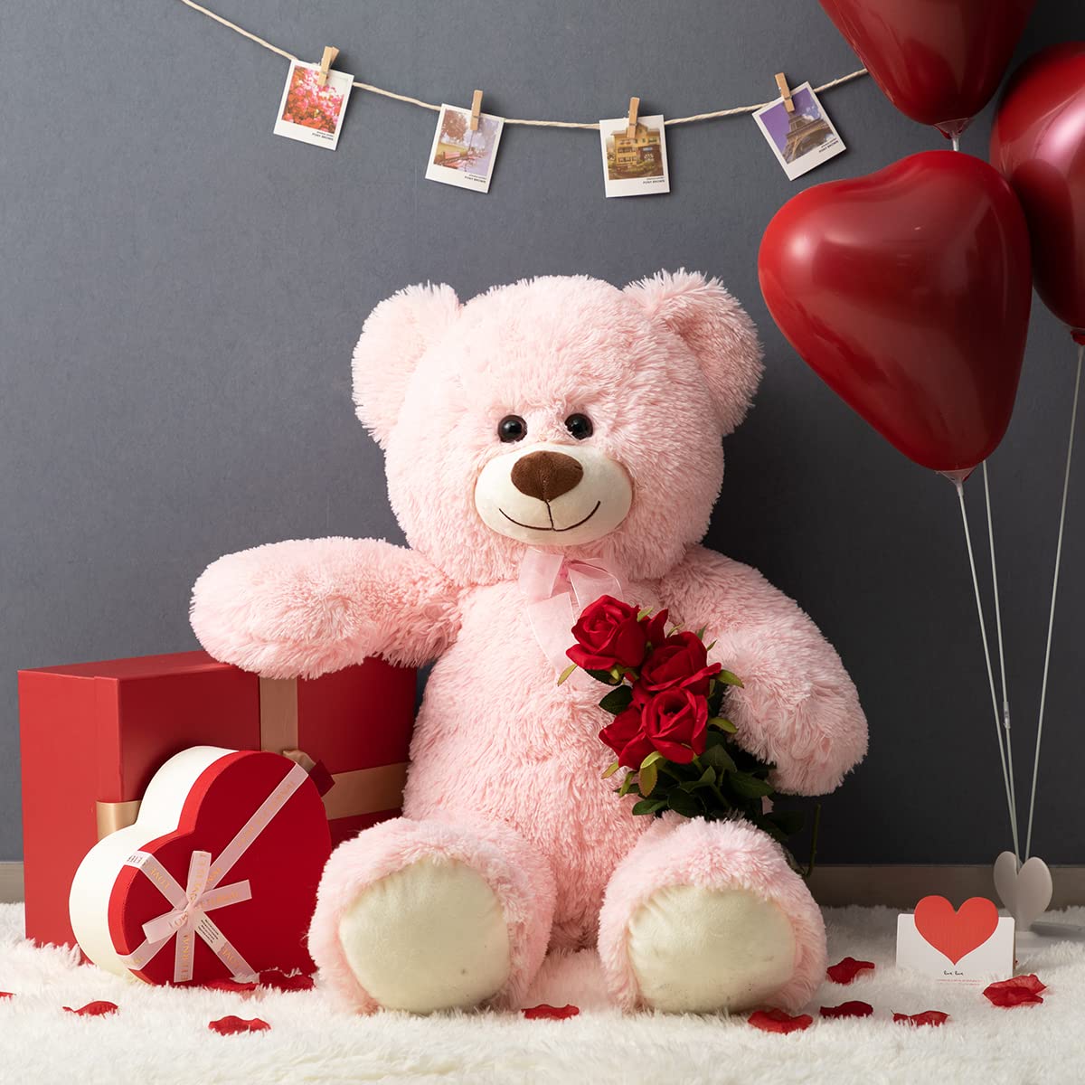 HollyHOME pink teddy bear close-up shows secure stitched eyes and ribbon bow