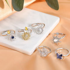 Honsny fidget ring with cubic zirconia flower for subtle sparkle and spin.