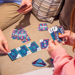 Closeup of a player's hand capturing card play in Snarkas.