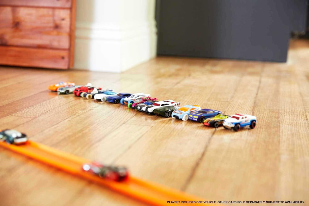 Hot Wheels 10-pack hot trucks, side view for storytelling and action play.