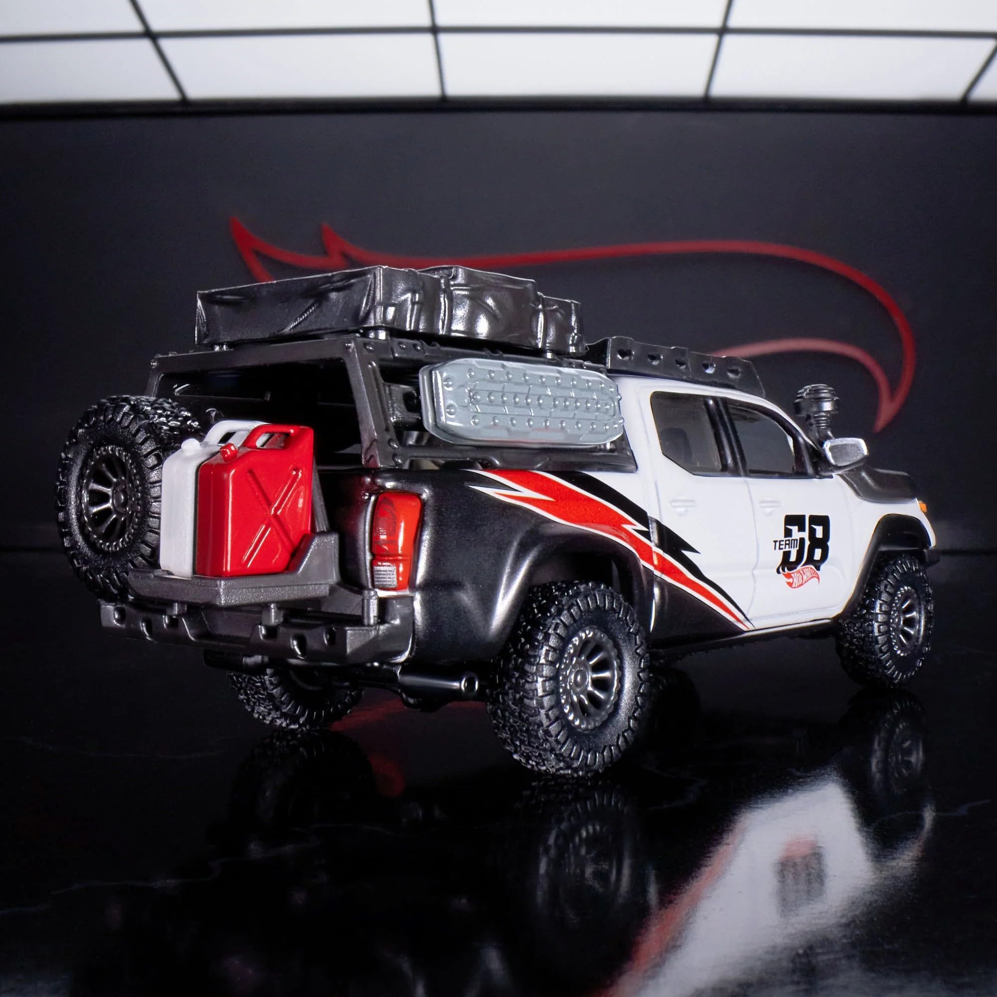 Hot Wheels Elite 64 Mod Shop 17 Tacoma bed rack and tent emphasize versatility.