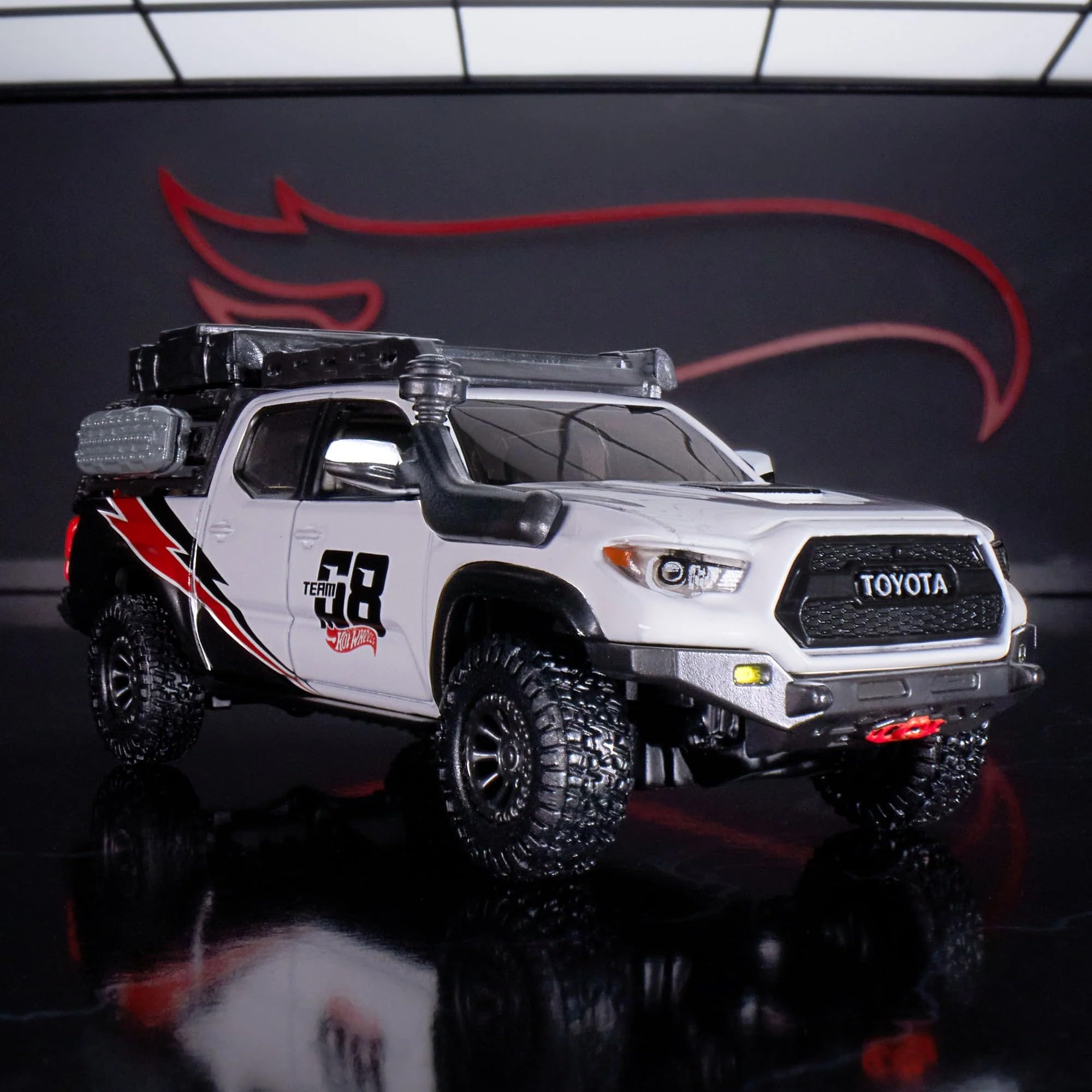Hot Wheels Elite 64 Mod Shop 17 Tacoma interior detail showcases black seats and controls.