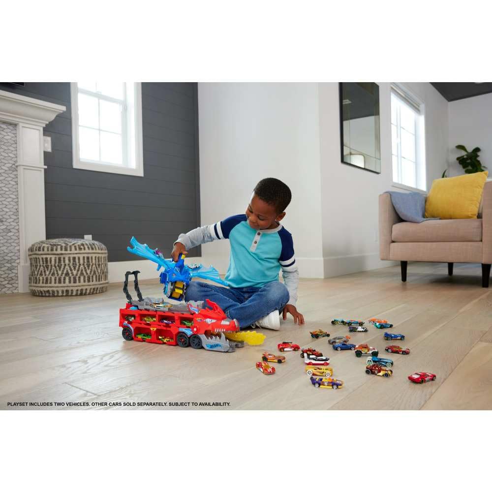 Hot Wheels fire-breath dragon in action, knocking out toy cars on its path.