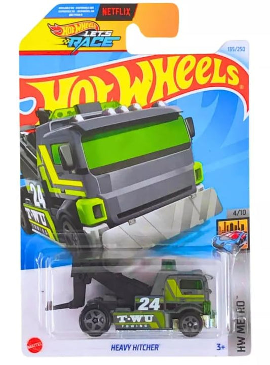 Hot Wheels Heavy Hitcher gray/green on a stunt track, ready for imaginative play.
