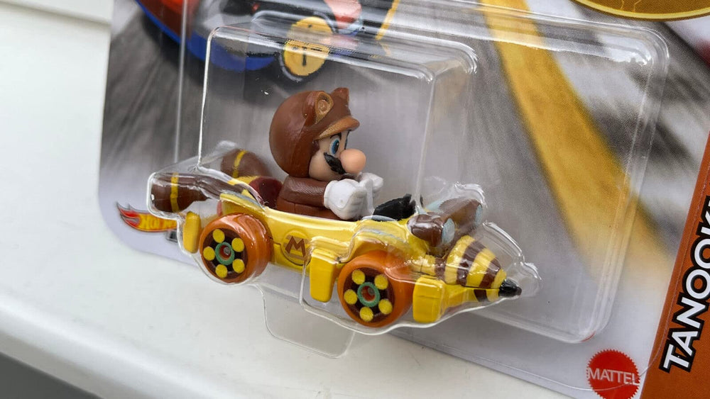 Tanooki Mario Bumble V figure on track with compatible Hot Wheels setups.