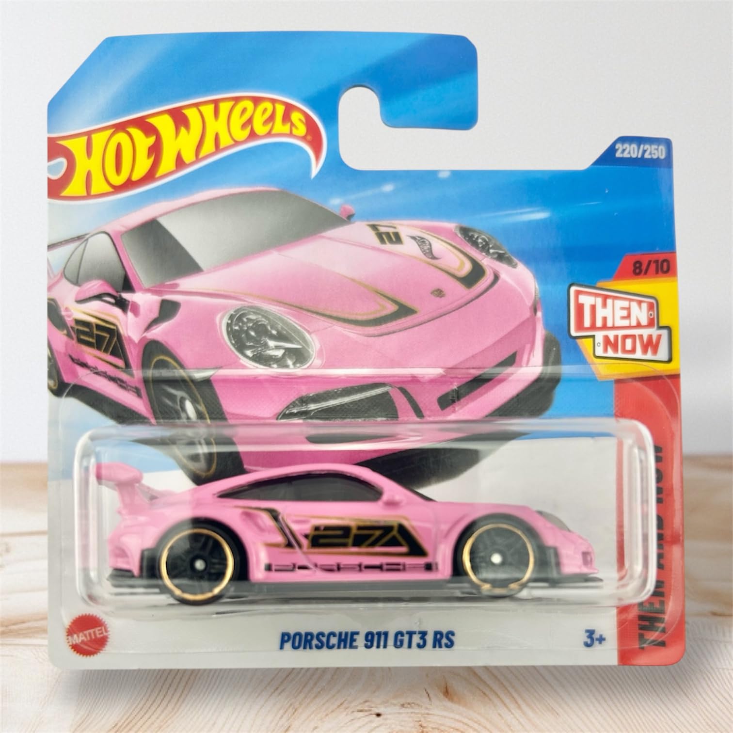Hot Wheels 1:64 scale Porsche model for shelf display.
