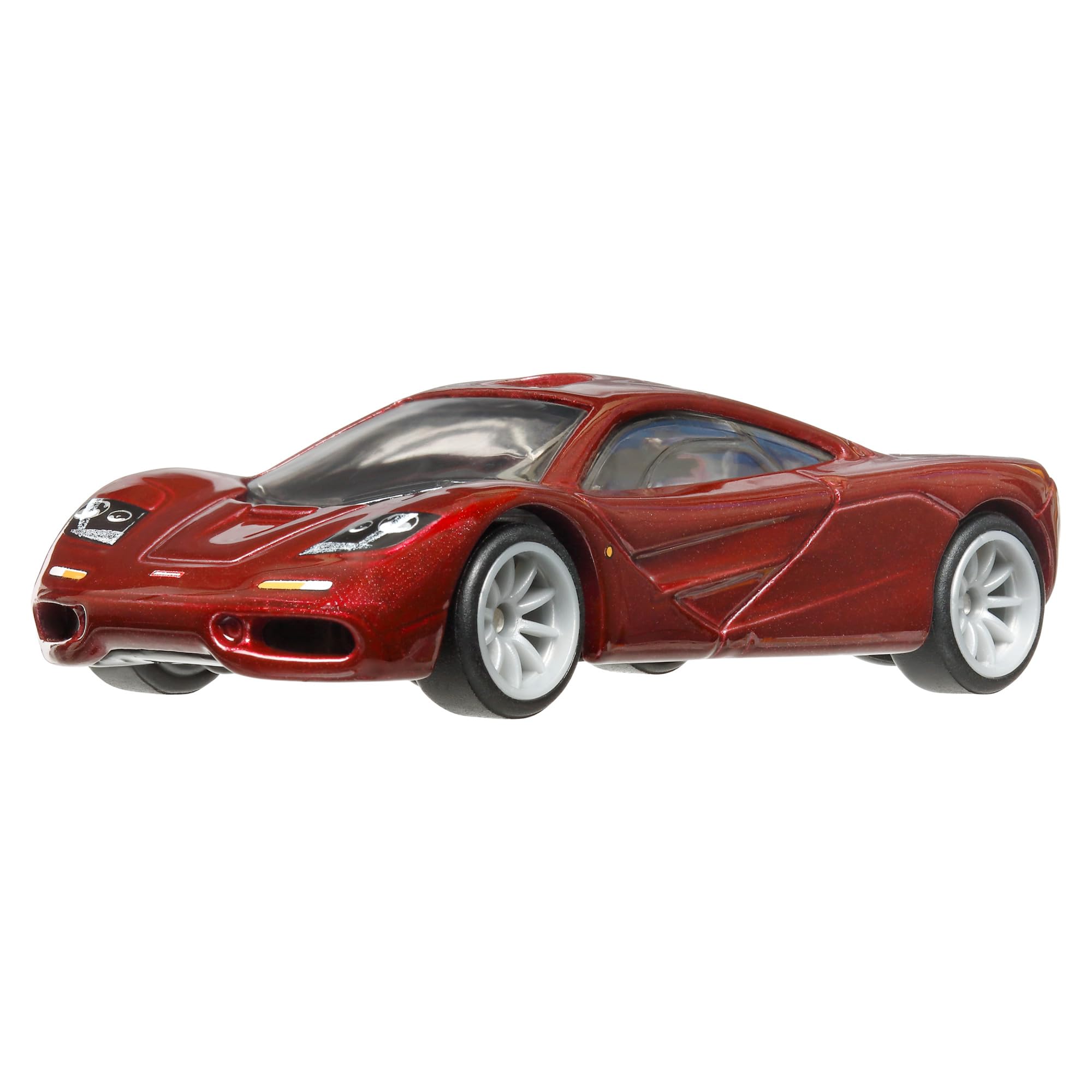 Hot Wheels McLaren F1 1:64 side view highlights Real Riders tires for collectors.