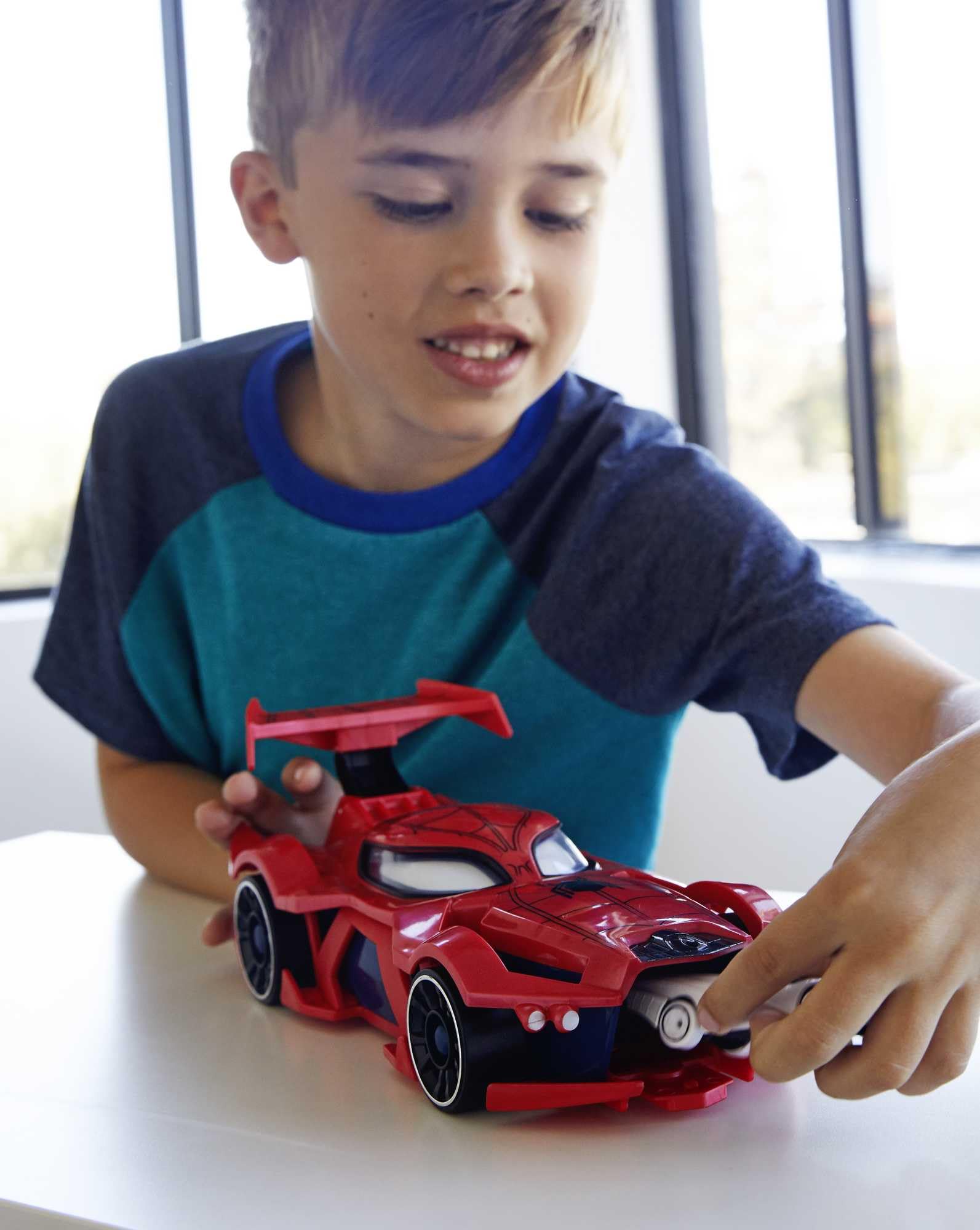 Hot Wheels Spider-Man spoiler action launcher demonstrates target-focused play.