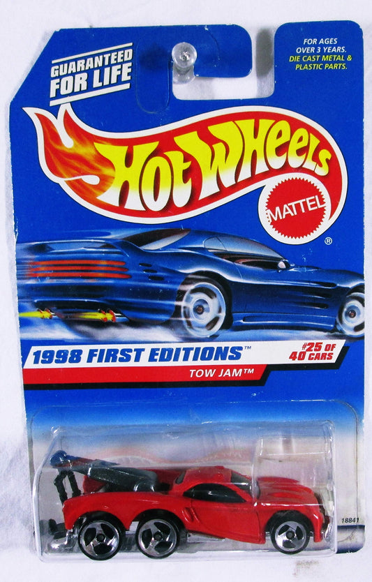 Hot Wheels Tow Jam 1998 First Editions red car on display shelf, ideal for collectors.