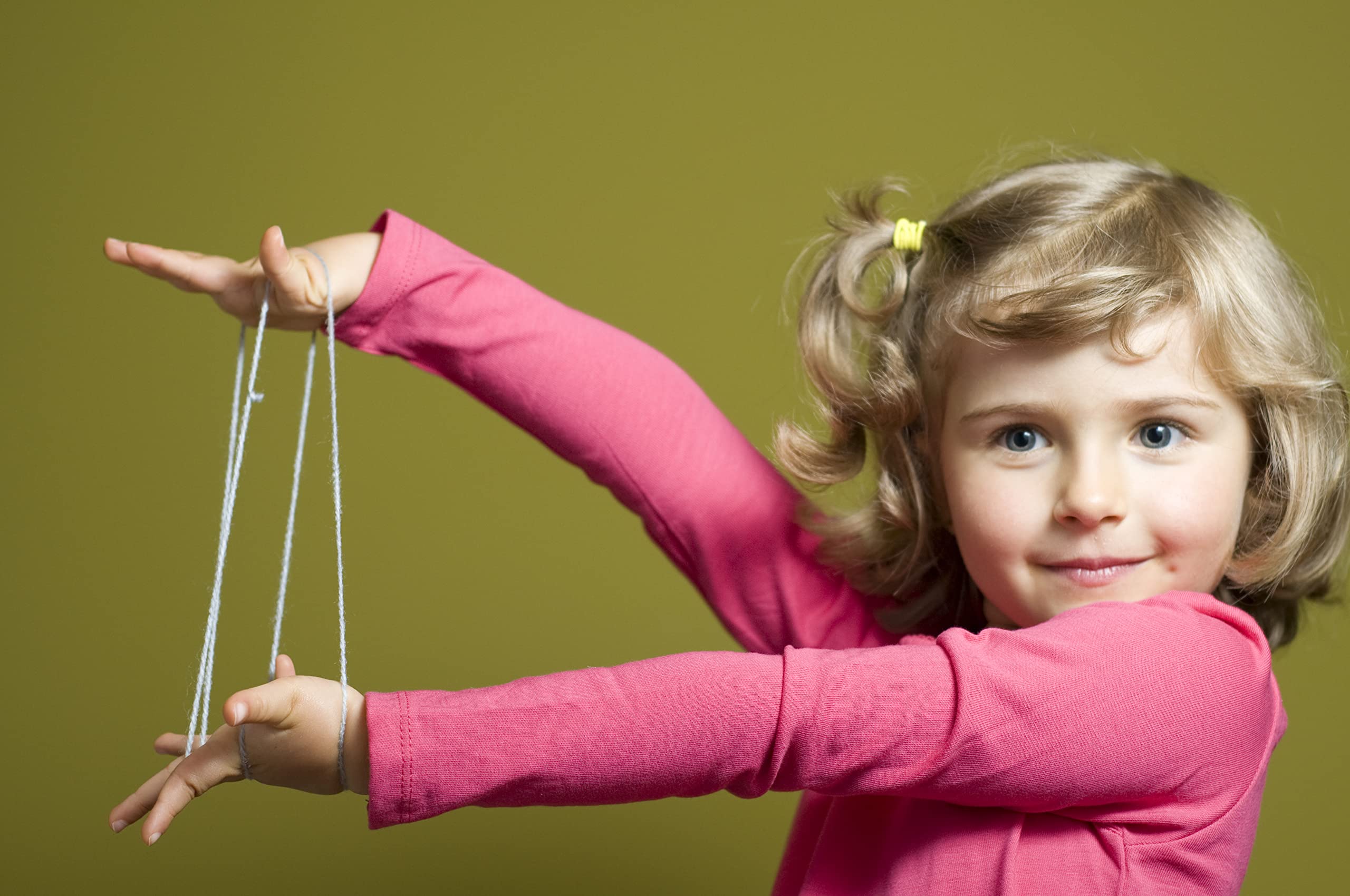 Close-up of hands weaving patterns to boost dexterity with House of Marbles