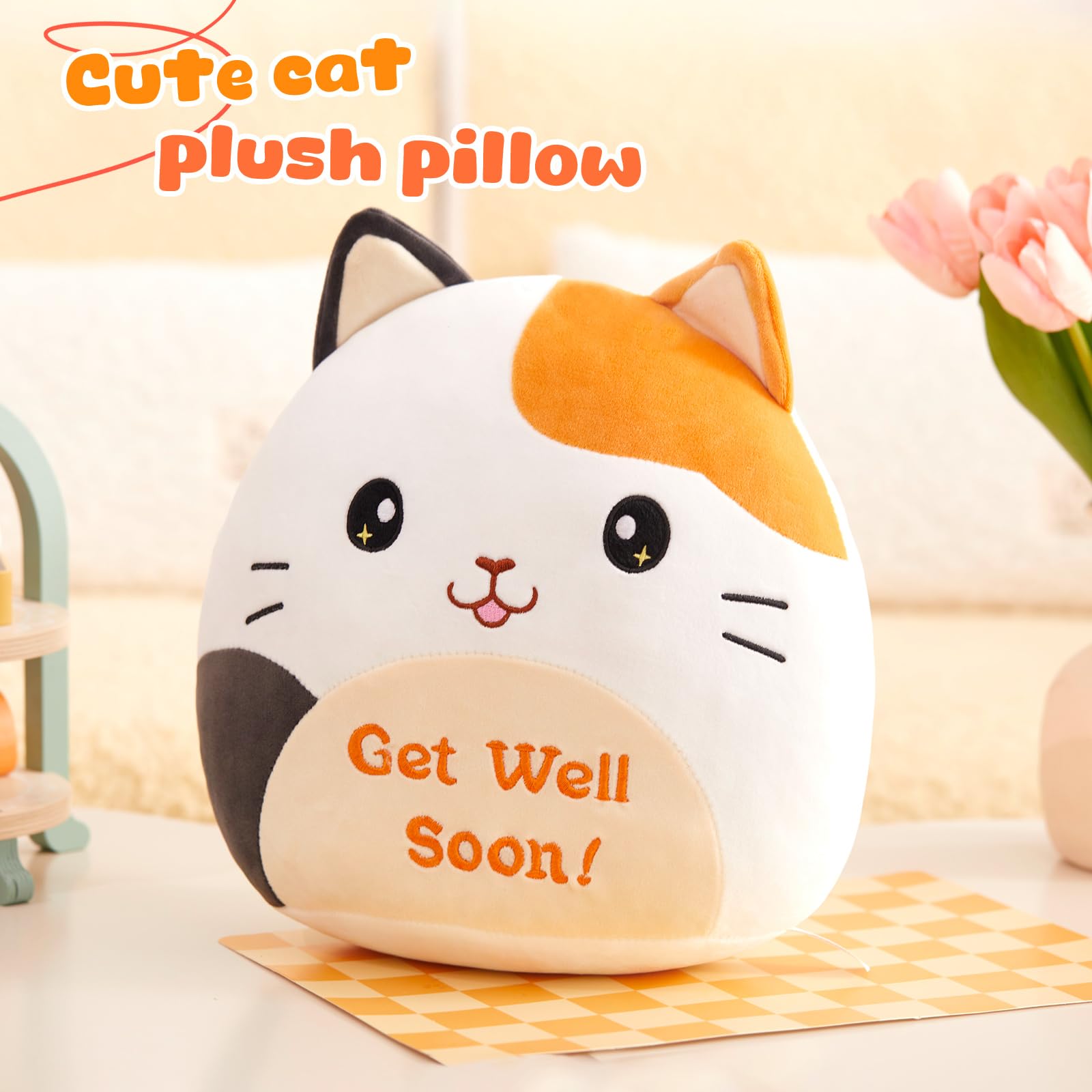 Close-up embroidery of calico cat detail adds charm