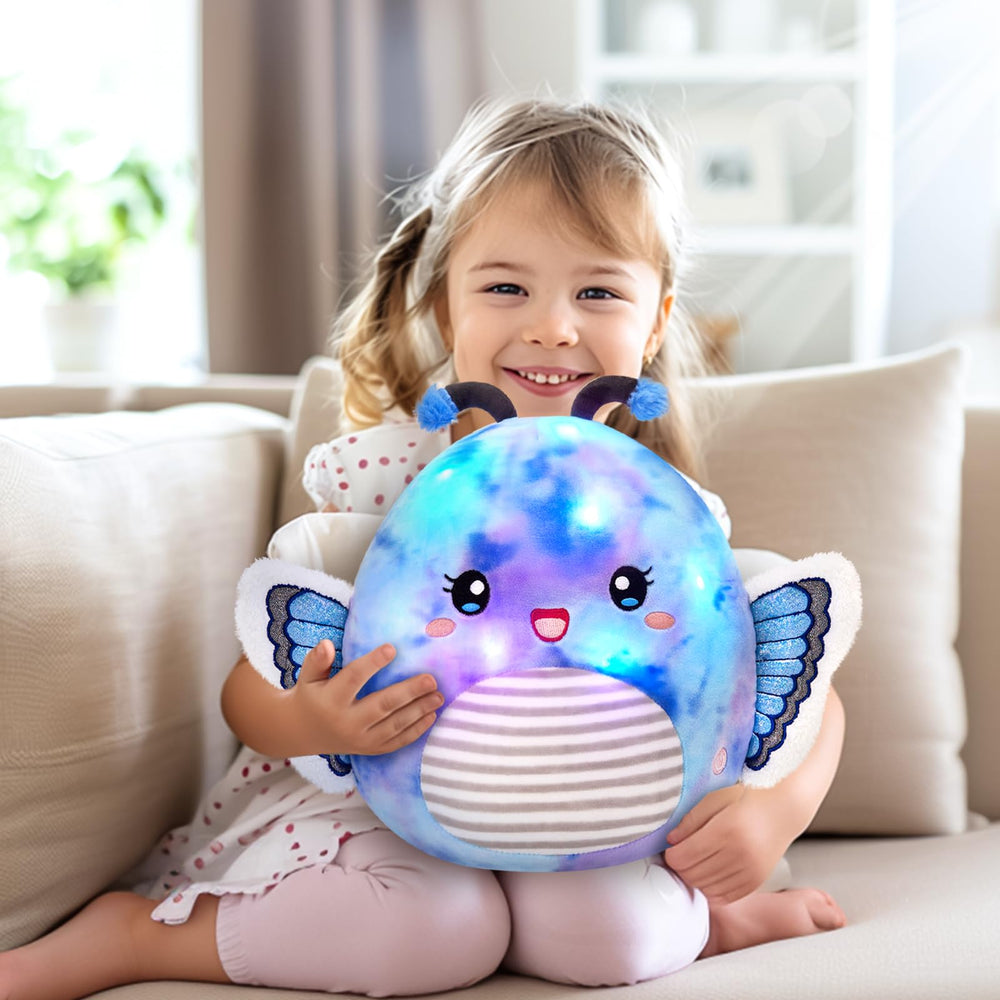 Houwsbaby decorative butterfly pillow on a sofa adds whimsical charm.
