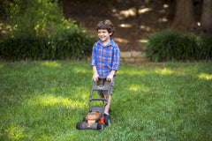 Husqvarna toy lawn mower designed for ages 2 and up for safe indoor/outdoor use.