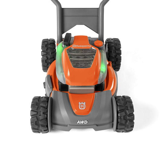 Husqvarna toy lawn mower lights and engine sounds enhance pretend play realism.