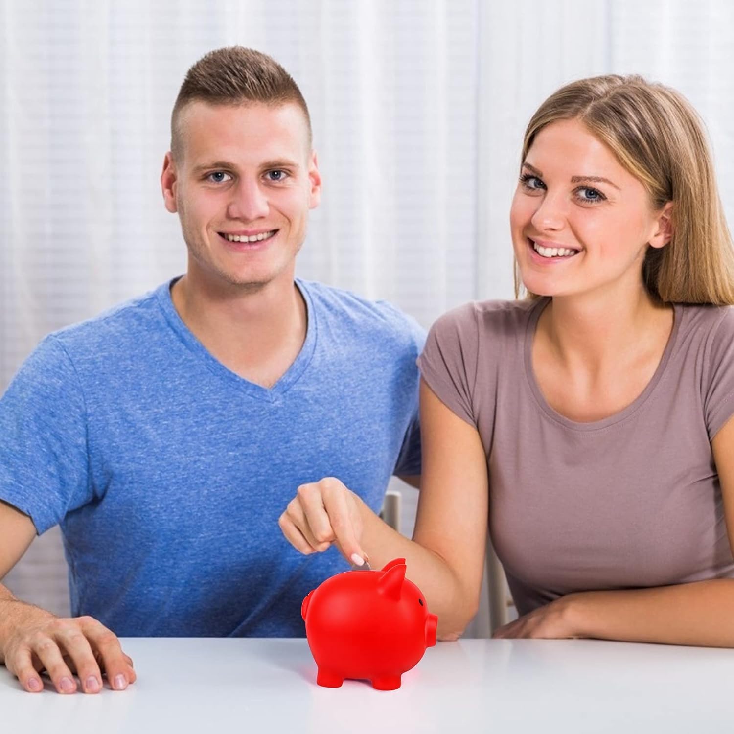 H&W red piggy bank on a dresser as a cheerful bedroom decor piece