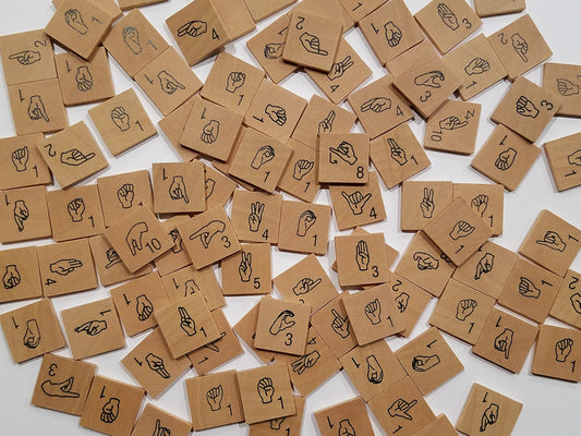 Iconoglyph ASL-alphabet-tiles for hands-on sign language learning at home.