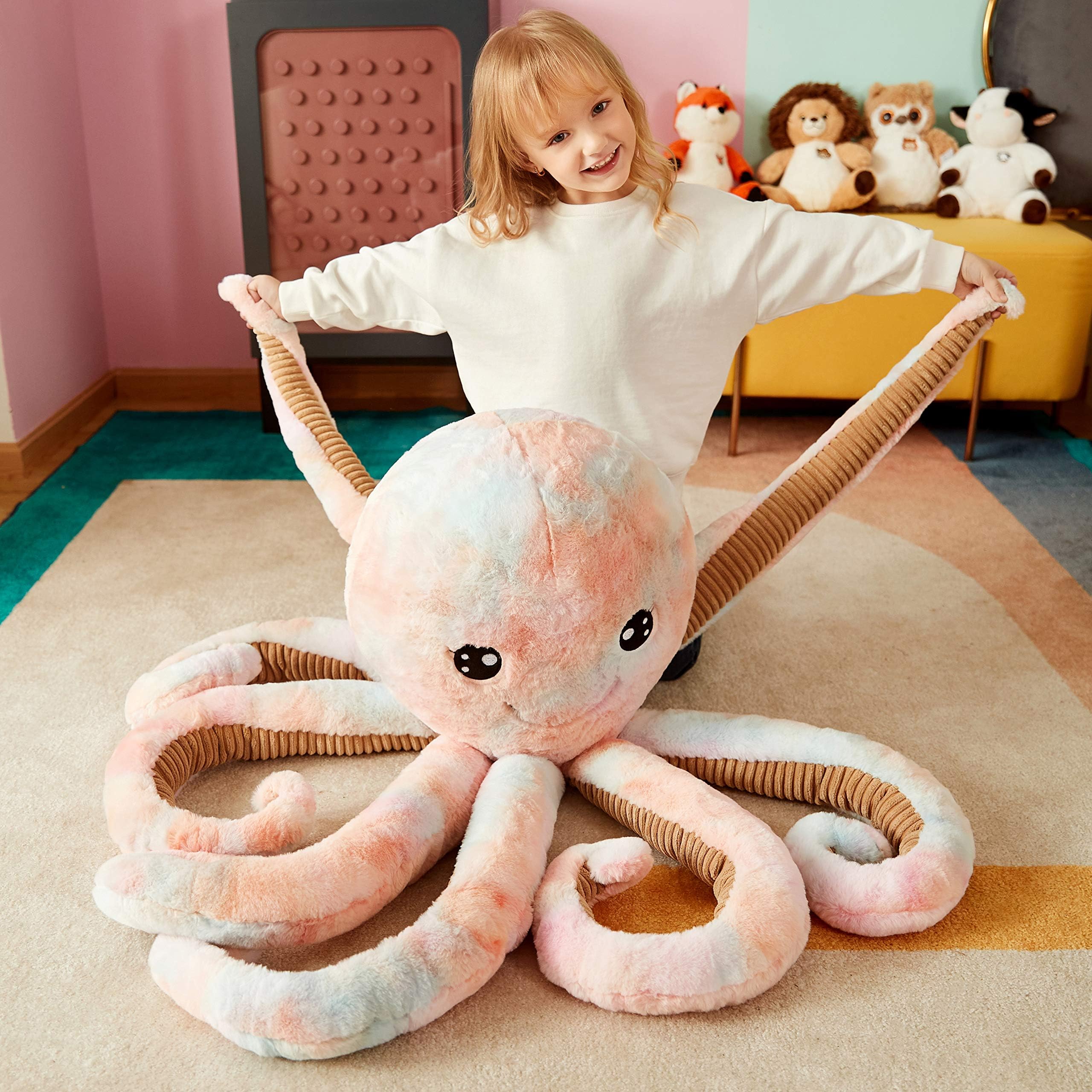 IKASA giant octopus plush in hand demonstrates large, huggable size.