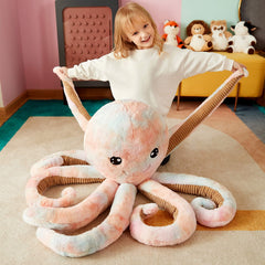IKASA giant octopus plush in hand demonstrates large, huggable size.