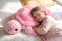 IKASA pink sea turtle plush adds cute decor and comfort.